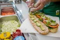Subway sandwich being made