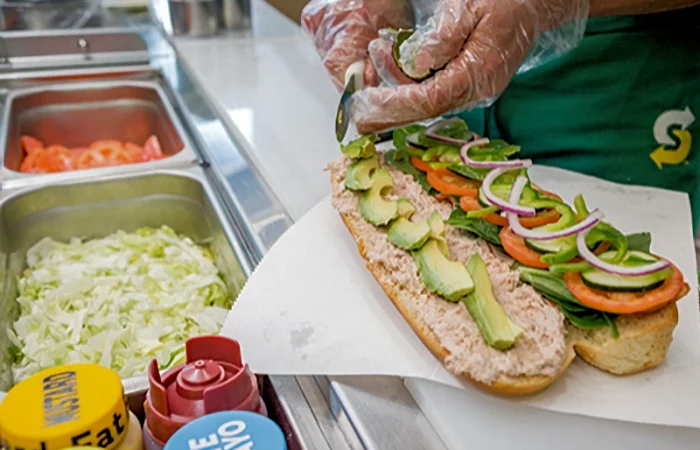 Subway sandwich being made